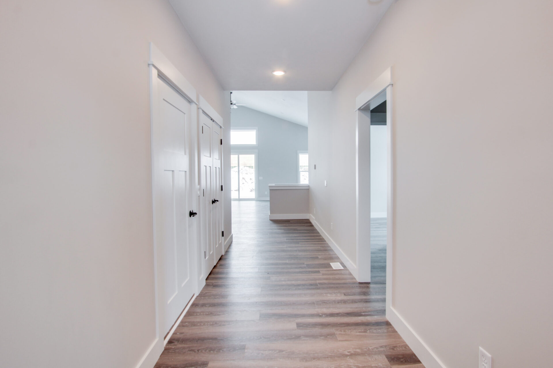 Long home corridor with several doors and spacious wardrobe