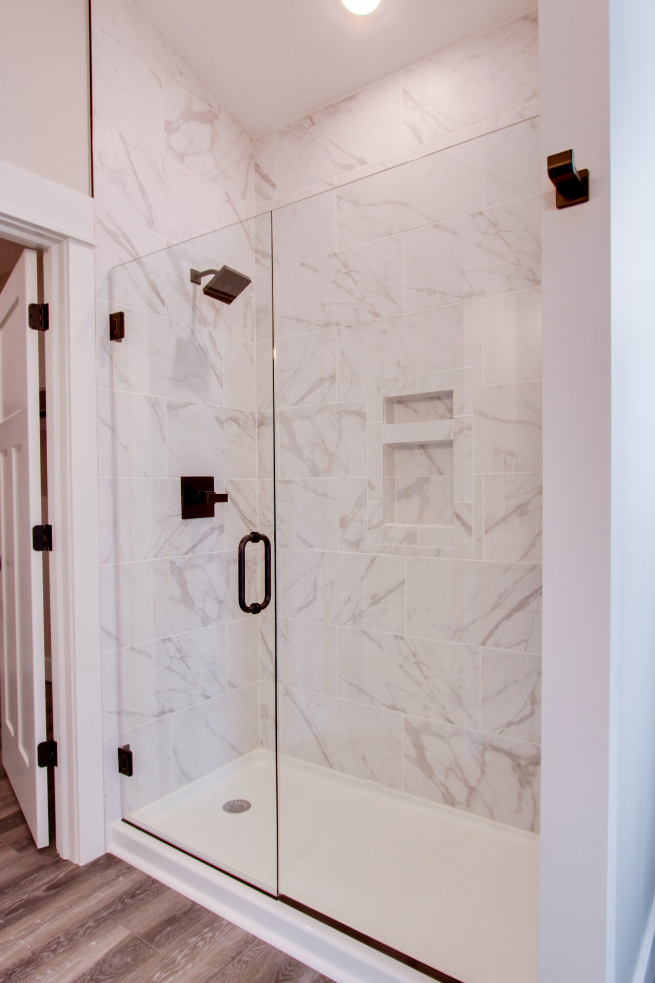 Bathroom interior with shower head and transparent door